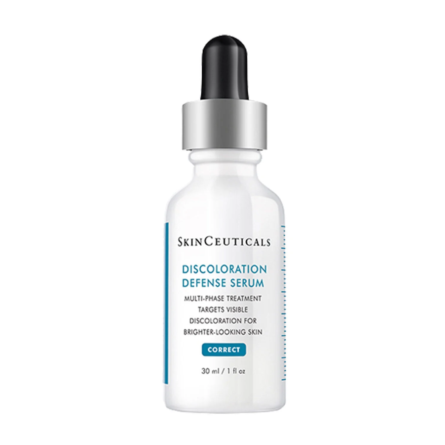 A white bottle of SkinCeuticals Discoloration Defense Serum with a black dropper cap. The label highlights its purpose to target visible discoloration for brighter-looking skin. The bottle contains 30 ml (1 fl oz).