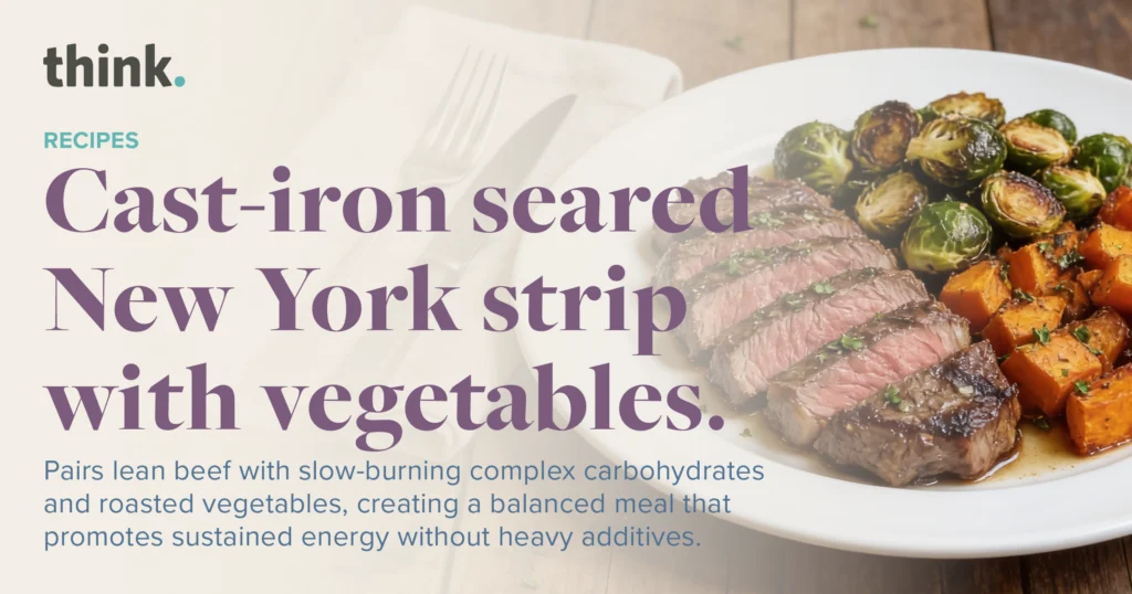 Sliced New York strip steak with roasted Brussels sprouts and sweet potatoes, accompanied by text describing the meal as a balanced, energy-promoting recipe.